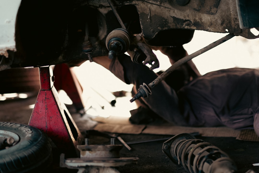 Busy Automobile Workshop: Mechanics at Work in a Garage